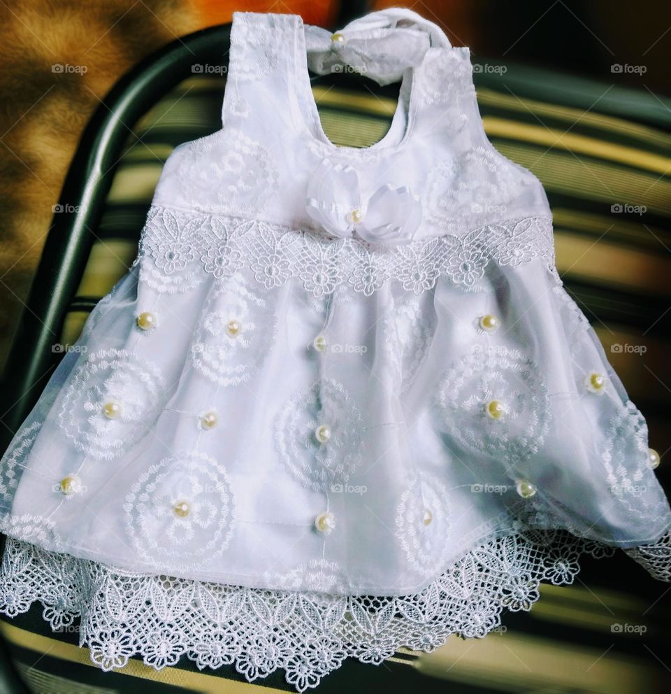 A beautiful white christening dress, made in embroidery by auntie.