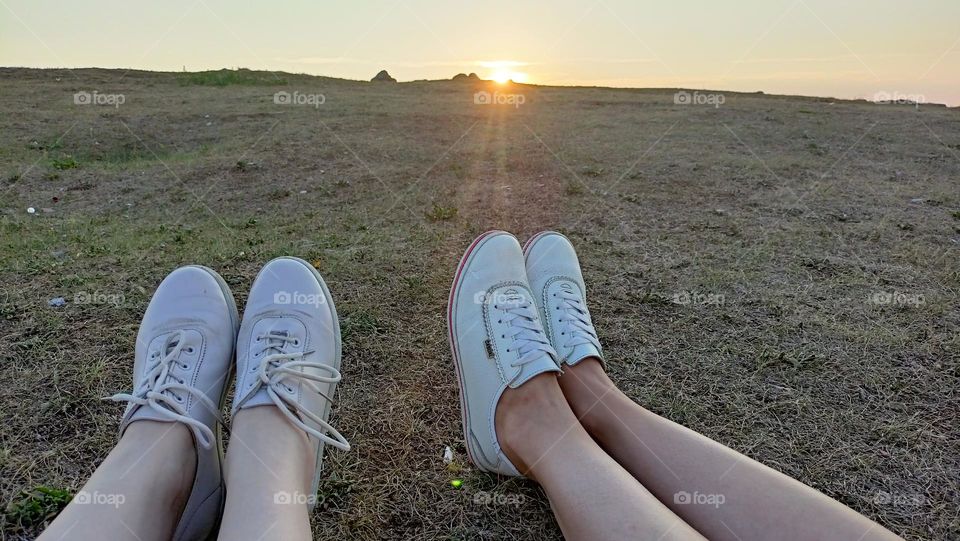 sunset on the mountain, nature, walk, happy moments, girlfriends, sunset, sun, sky, women's legs, shoes, grass