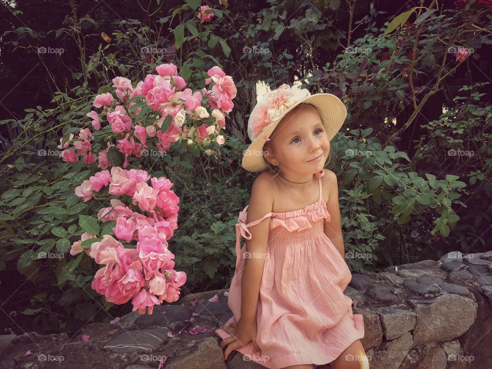 Little girl portrait in roses
