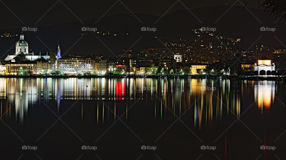 Como lakefront. Palaces, lights and reflections of the Como lakefront, from the cathedral to the Volta temple, seen from the lake