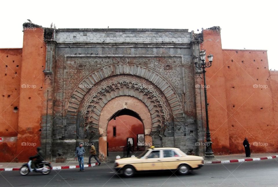 Car passing an arch in Marrakech 