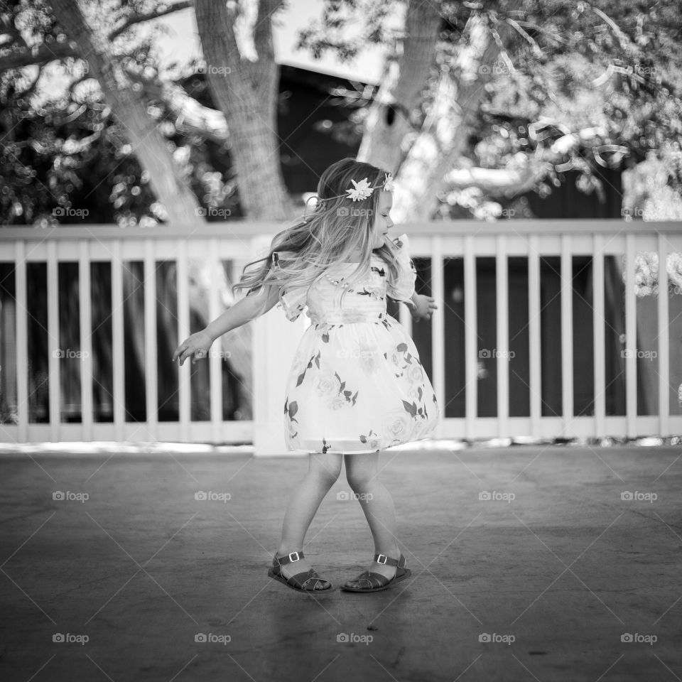 Twirling. Feeing like she's in a fairytale, twirling in a gazebo 