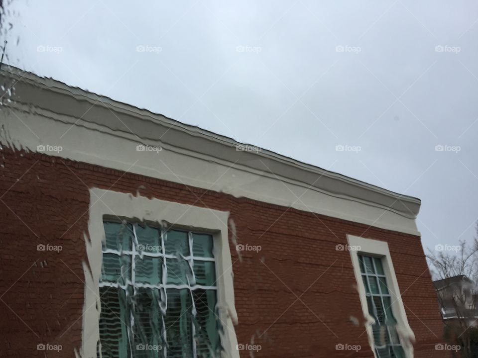 Red brick building in the rain Fairhope Alabama 