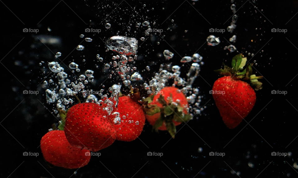 Strawberry fall into the water.
