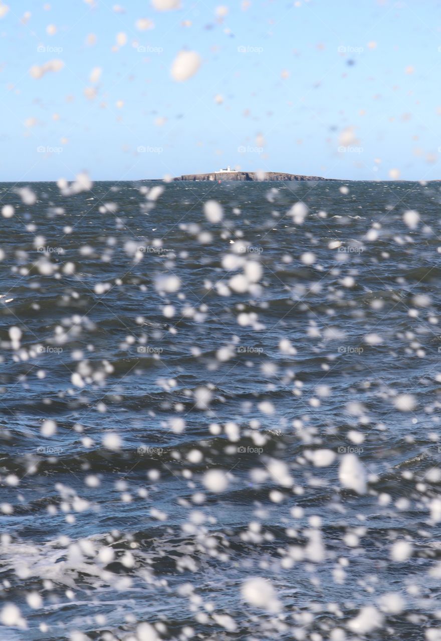 Sea spray from waves looking towards Farne Islands