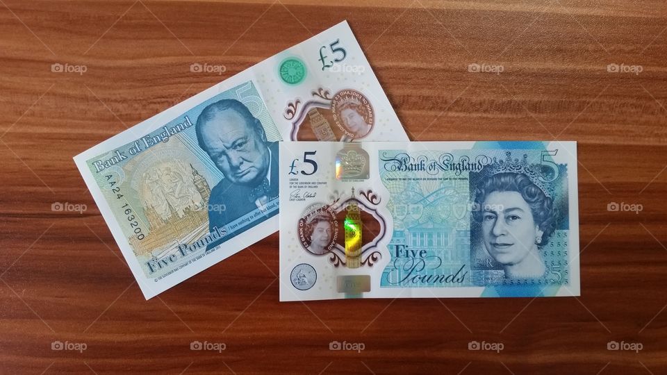 The new 5 pound notes, suitable for blog posts related to finance, money saving, budgeting, investing, insurance or related topics.