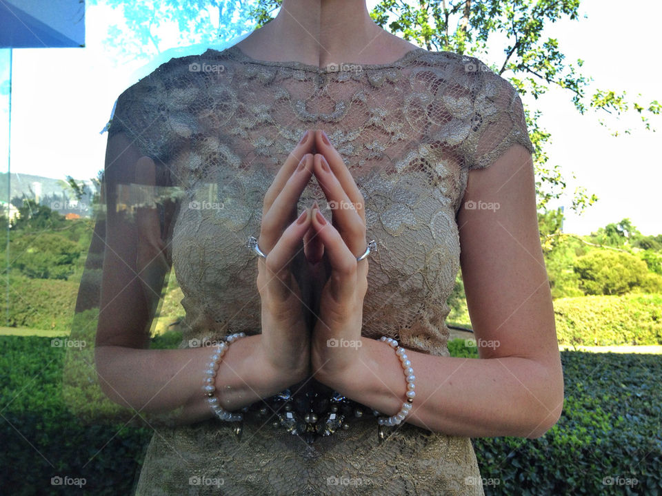 Bride-to-be hand mirrored showing engagement ring