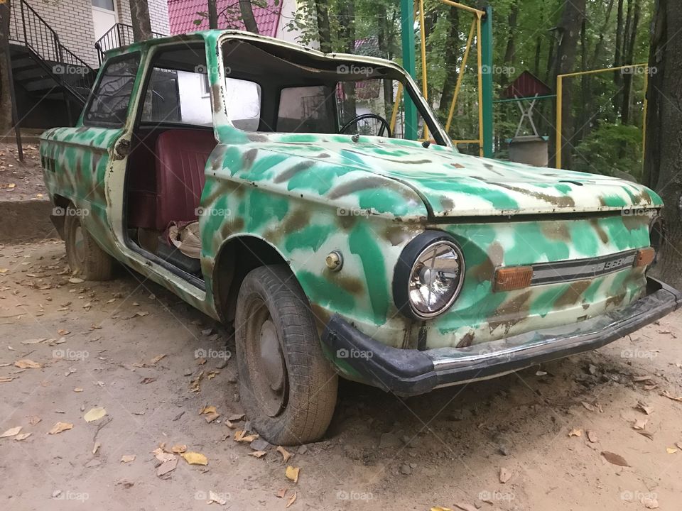 Old car without doors. Camo 