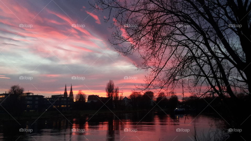 Dramatic sky during sunset over city