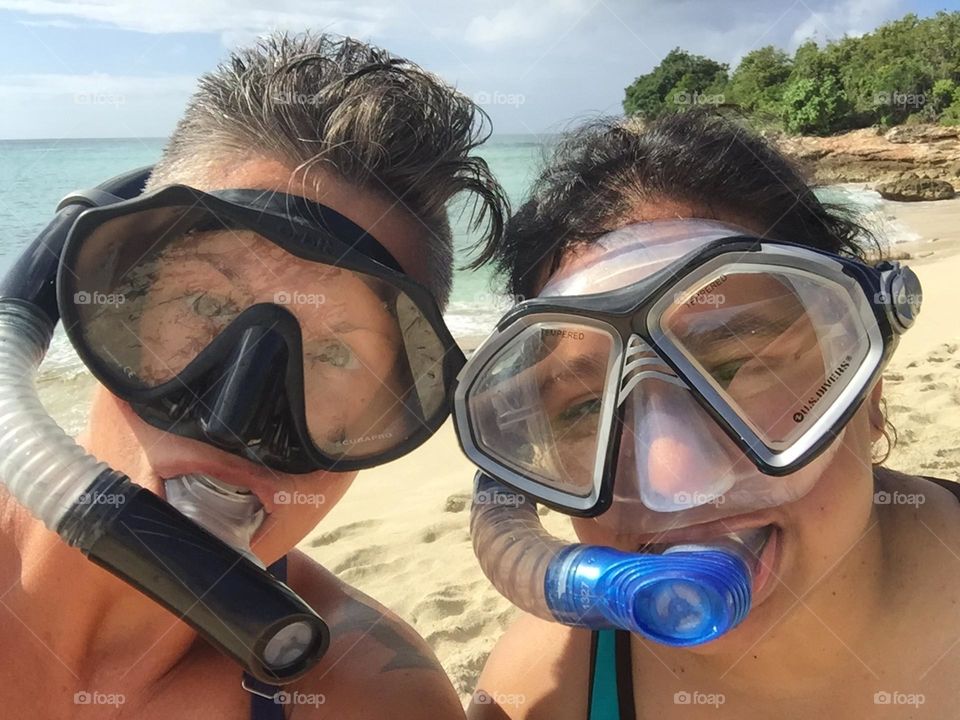 Two girls snorkeling, summertime fun on St. Maarten, snorkeling on an island, fun snorkeling pose