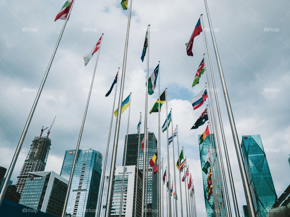 Flag, Flagpole, City, Sky, Wind