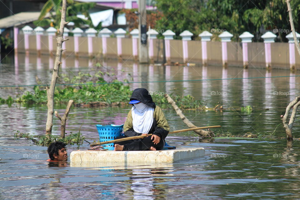 A man is helping the flood victims.