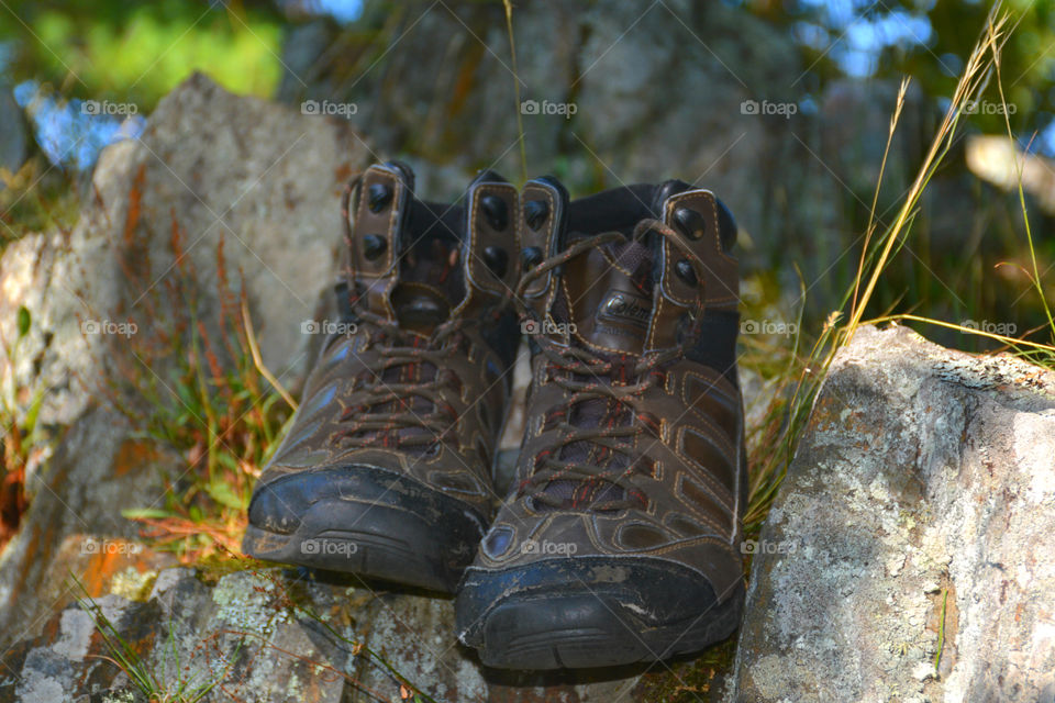 The boots were old. The leather had since cracked and aged. The toes were scuffed and they were falling apart at the seams. The boots had long lived their life of travel,work,joy, and love. After their final journey, it was time to throw them away. It was hard to say GOODBYE!