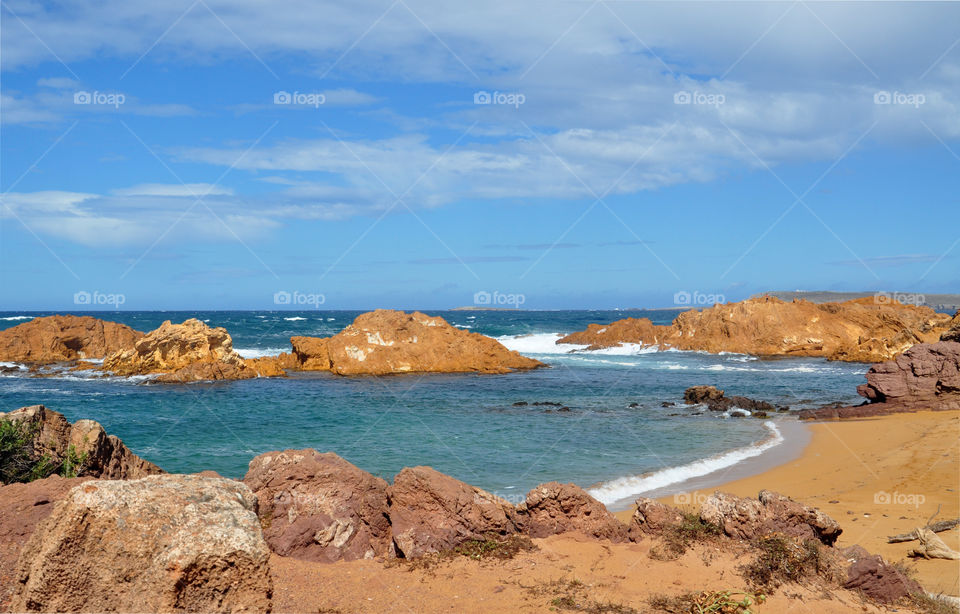 cliffs on the beach of menorca Balearic island in Spain