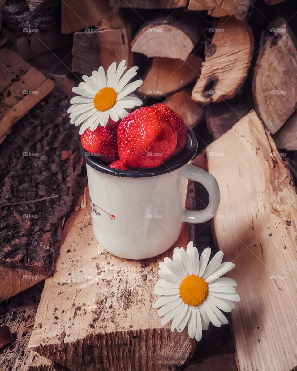 bright strawberries in a metal mug. summer food