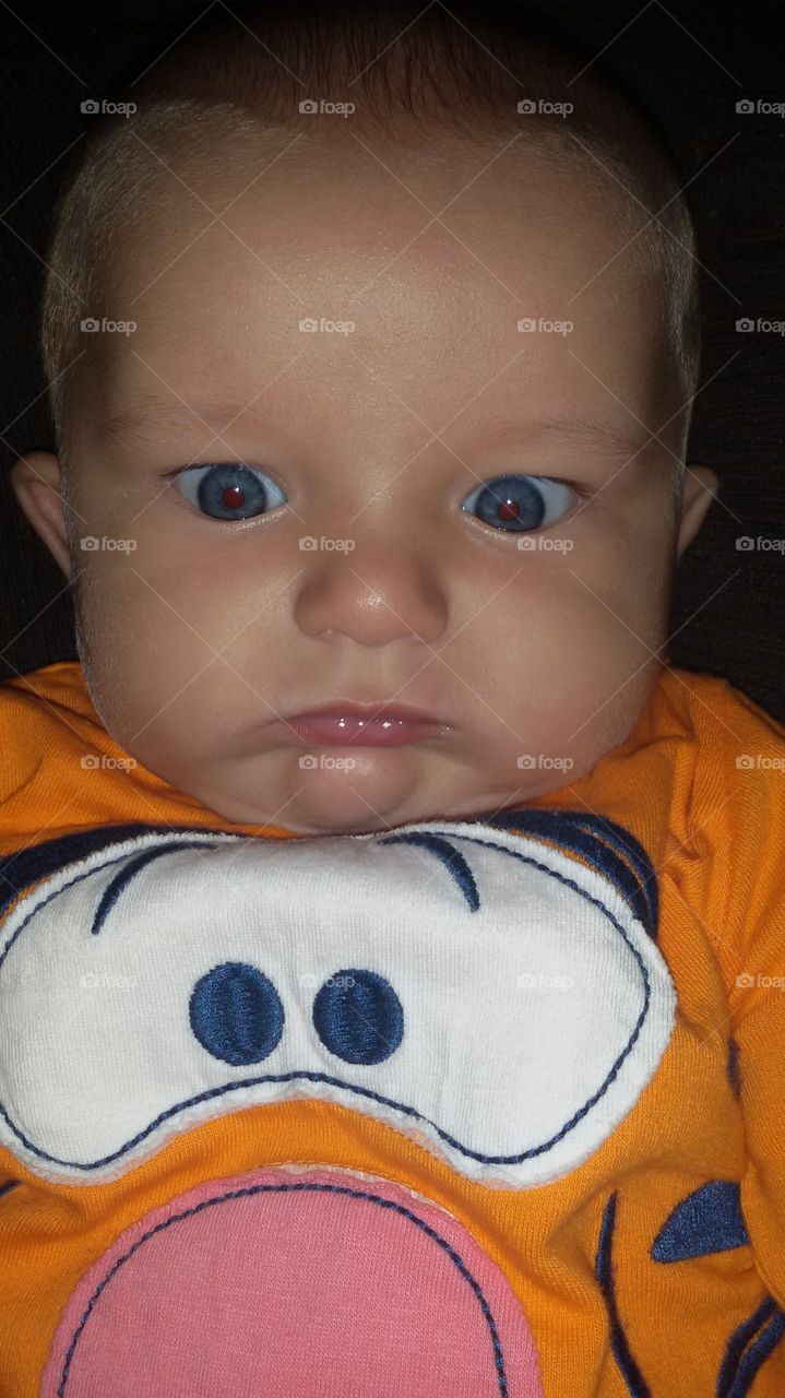 baby grimacing with hunger