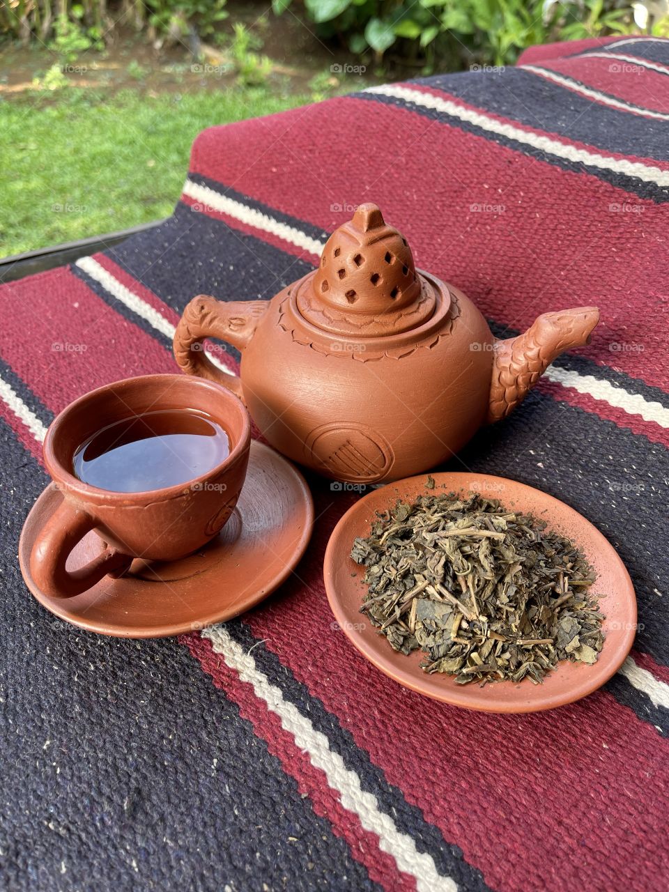 Traditional clay tea pot with organic tea, such a healthy drink