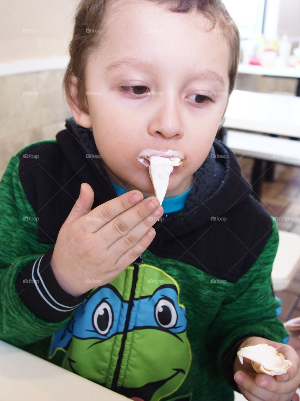 A little boy hilariously loses control of his vanilla ice cream as a giant bunch leaves the cone unexpectedly. 