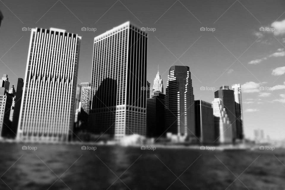 New York City tall buildings in black and white, architecture in black and white, New York from the water, skyscrapers in New York City, buildings standing tall in New York