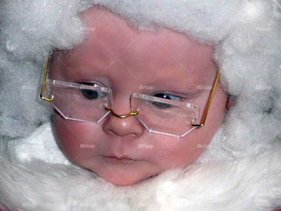 Seriously Santa: Aunt Jane makes costumes and makes us wear them. Well, she makes the smallest "us's" among us wear them and this photo captures my son's turn. Two months old and River is now Kris Kringle, but with a serious, spectacled look.
It's another Christmas at Grandma's house which is one of the sweetest lines I have ever written.
Another simple, yet special holiday, but this time with my little man, Mr. Claus.  This time there is a little one for Aunt Jane to dress and for all the grand and great grandparents to spoil...if holding and cuddling and kissing could ever spoil anyone.