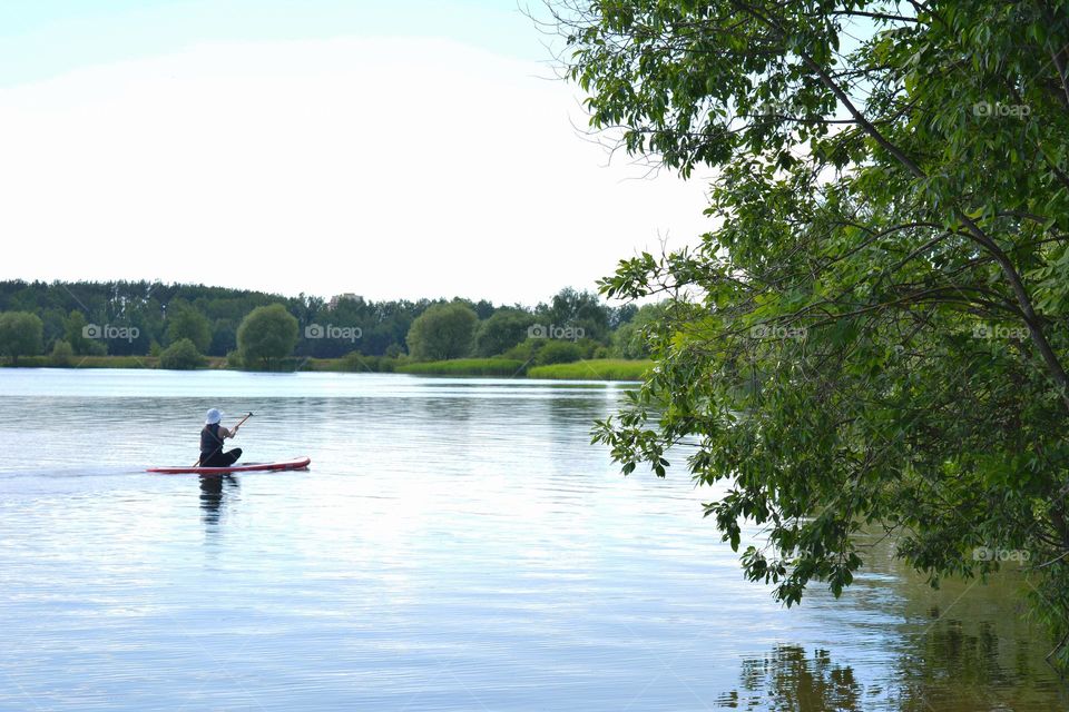 woman on a boat summer time beautiful landscape lake