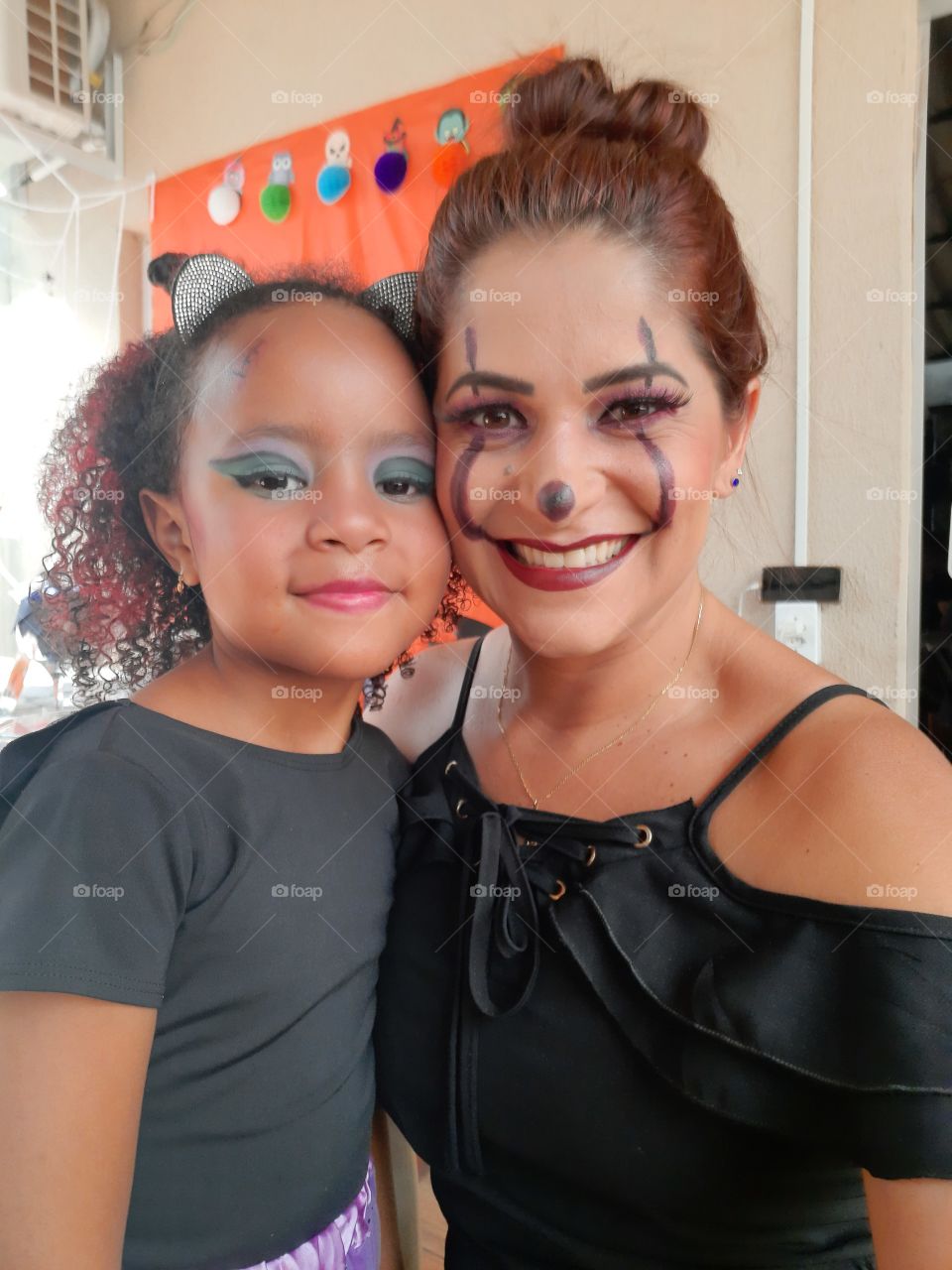 pretty girl and aunt dressed in halloween theme
