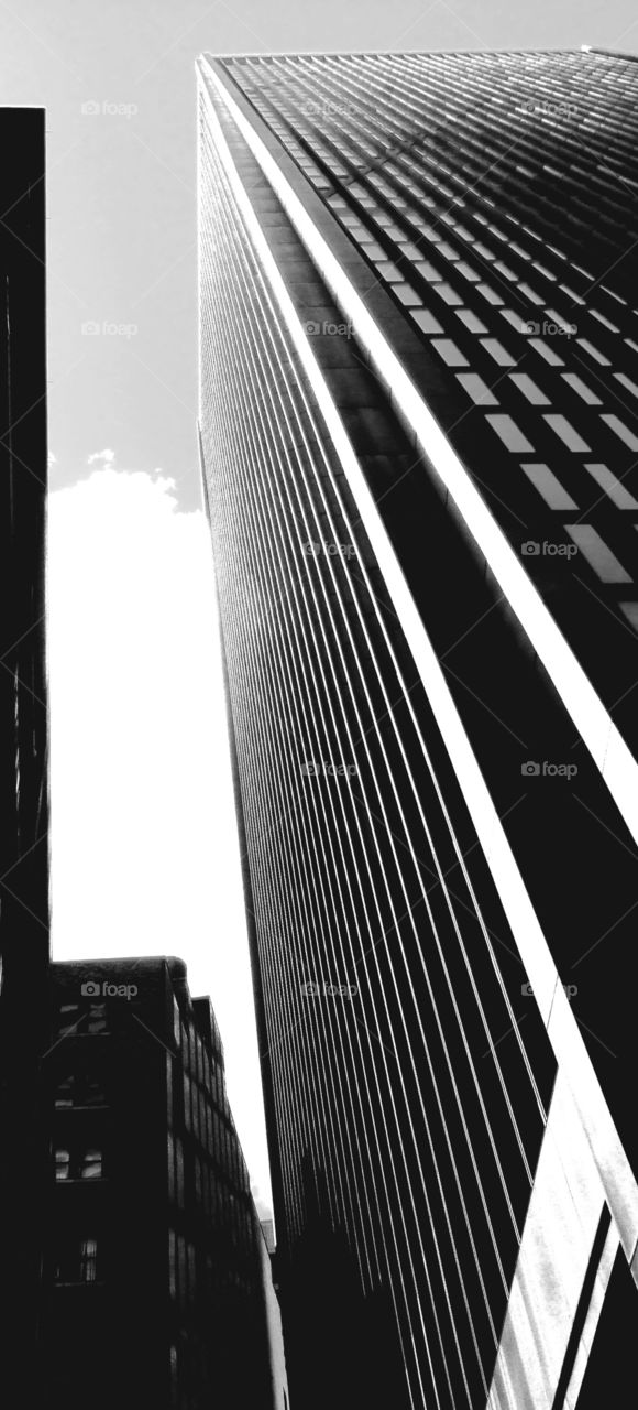 Old and New. Two office buildings from different eras in black and white in stark contrast 