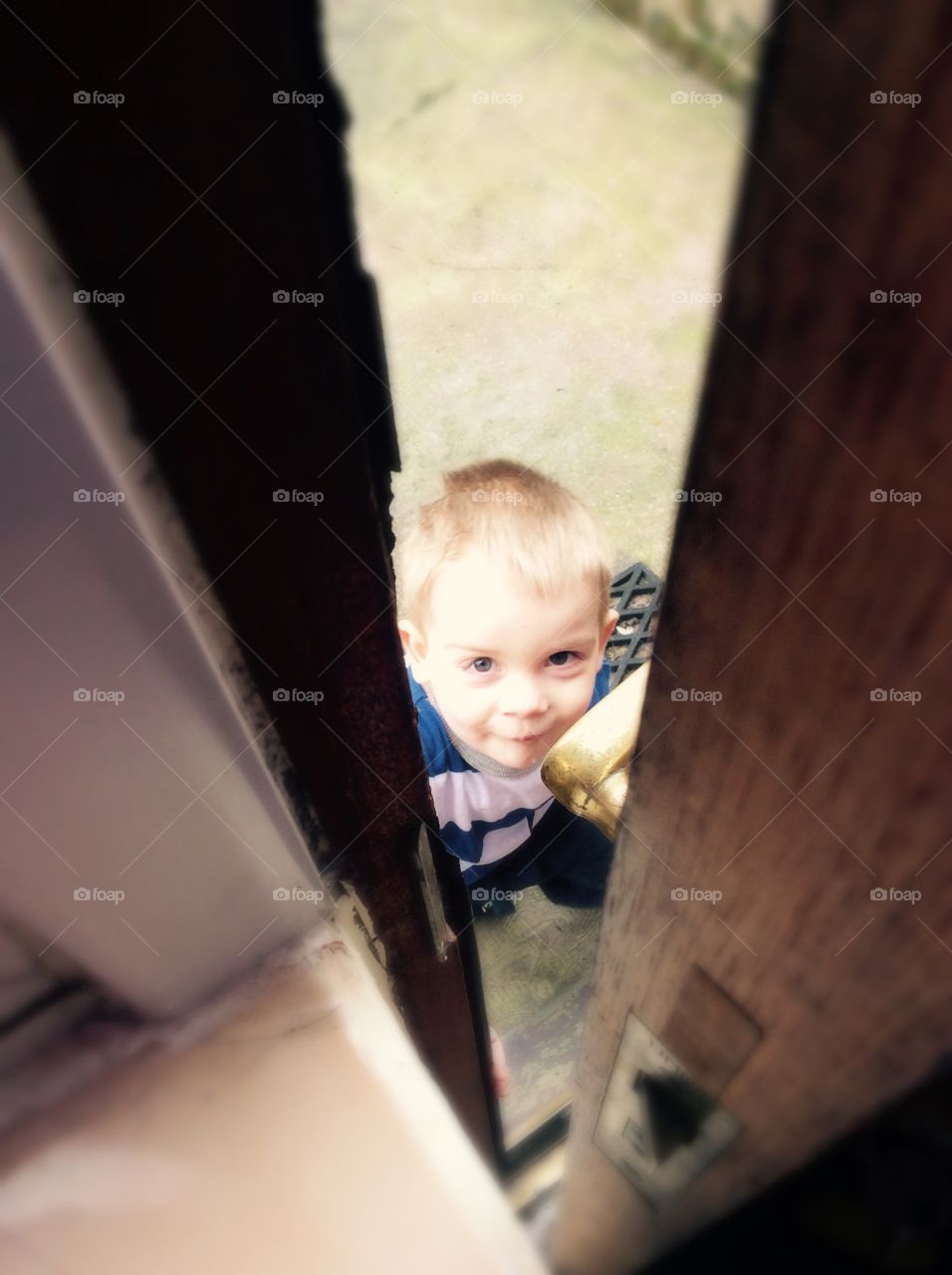 My son, Austin peeping through the door at me. 