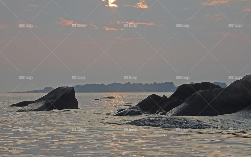 Rocks at sea and sunset at ronneby skargard sweden