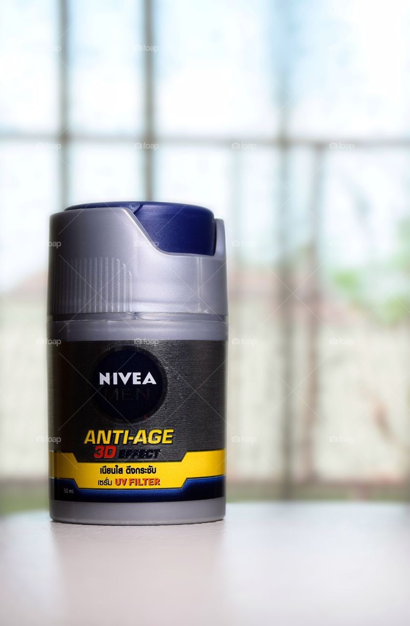 Nivea​ Men​ anti-age​ 3D​ effect​ uv filter​ With Blurred Curtain Background.