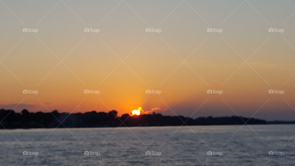 Sun now set over Lake Ontario on summer evening