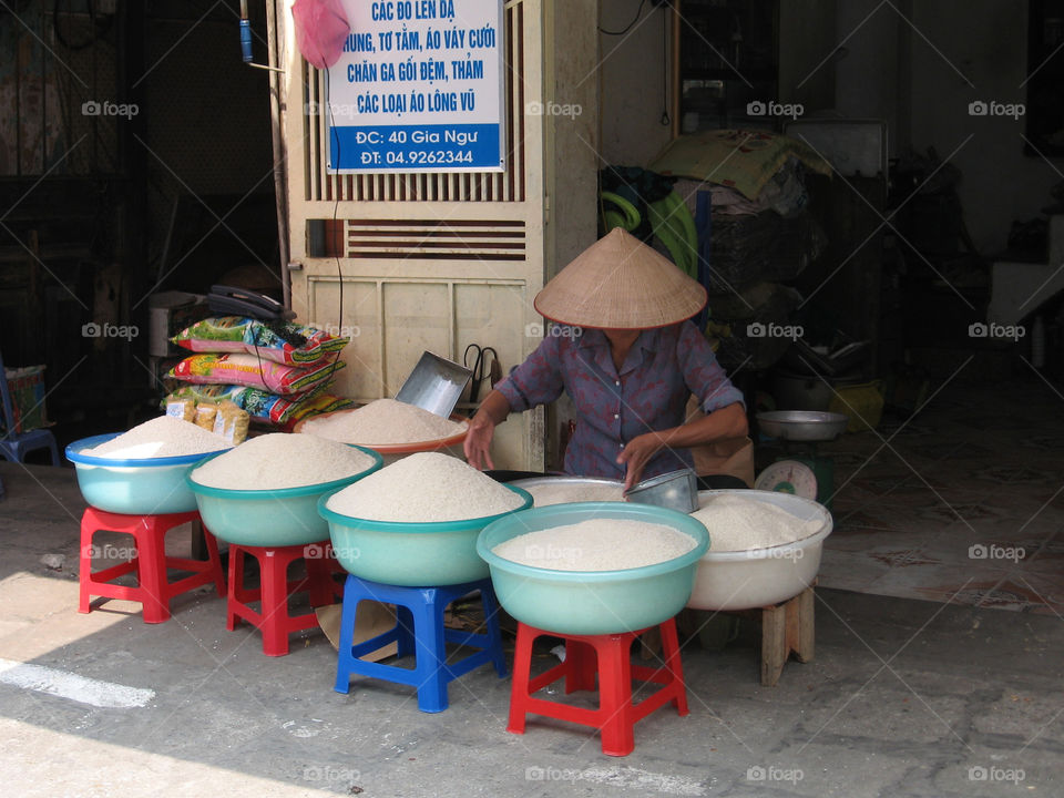 Traditional rice seller in the street of Hanoi (Vietnam)