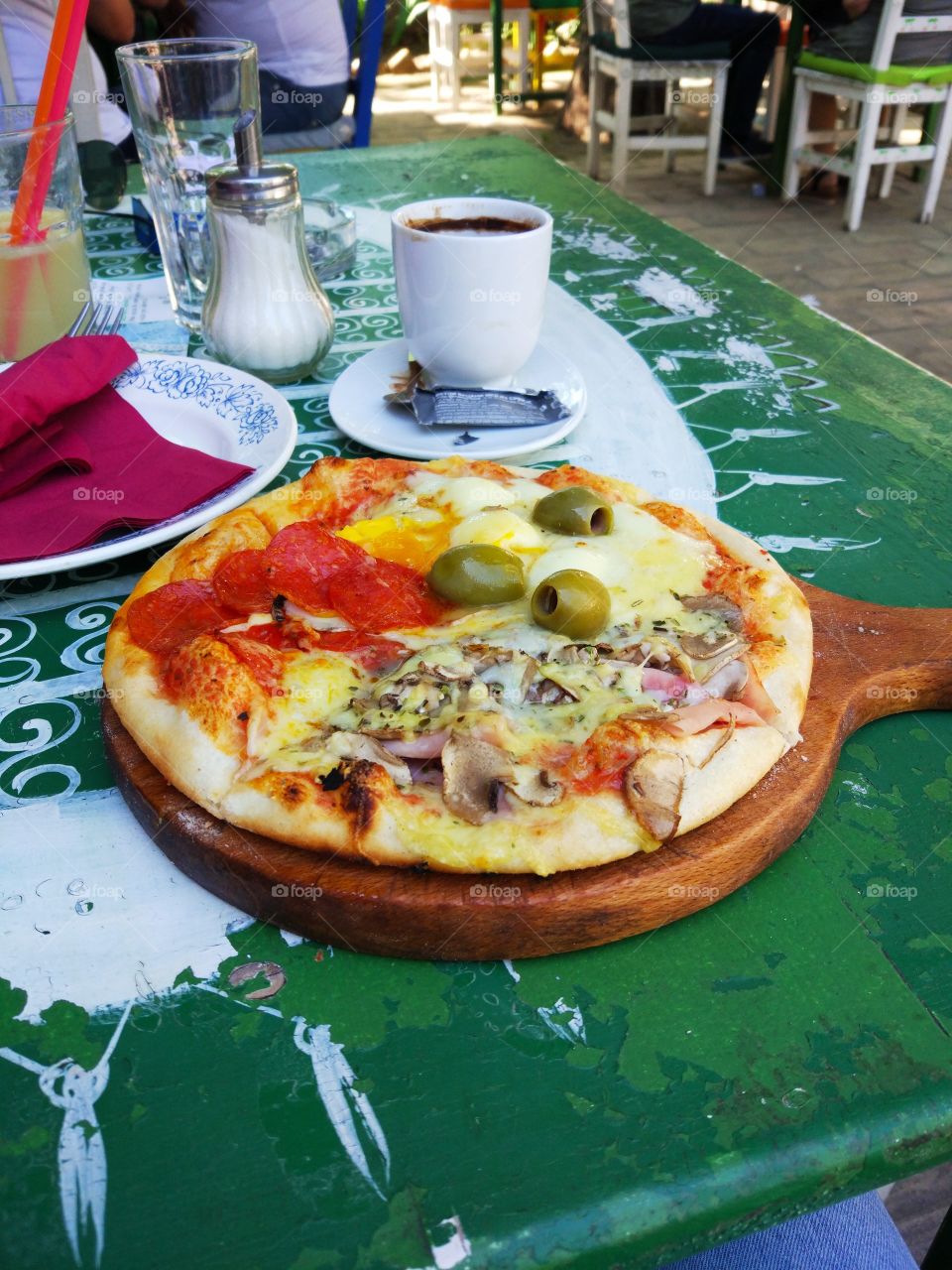 Tasty quattro stagioni pizza and coffee in the white cup