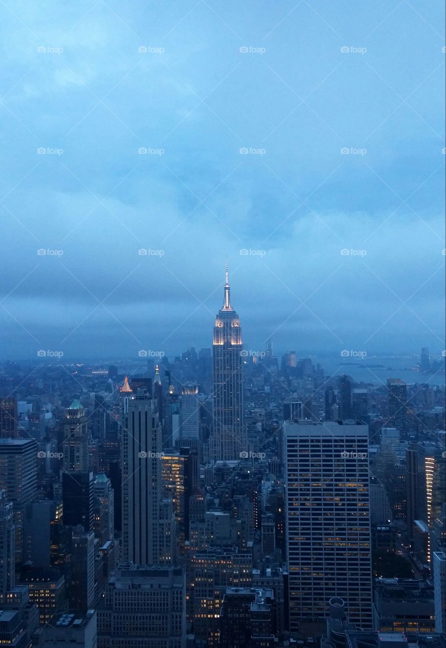 Cloudy Empire State. View of the Empire State Building from the Top of the Rock (Rockefeller Center) on a cloudy but beautiful summer night.