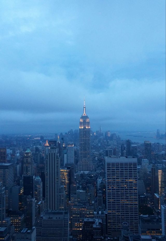 Cloudy Empire State. View of the Empire State Building from the Top of the Rock (Rockefeller Center) on a cloudy but beautiful summer night.