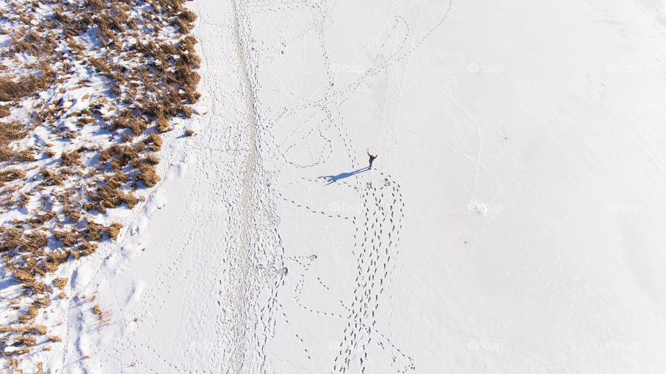 Man and heart on the frozen river 