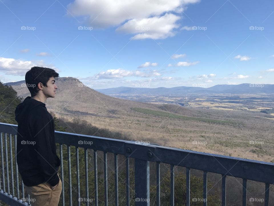 Son looking out at the mountains