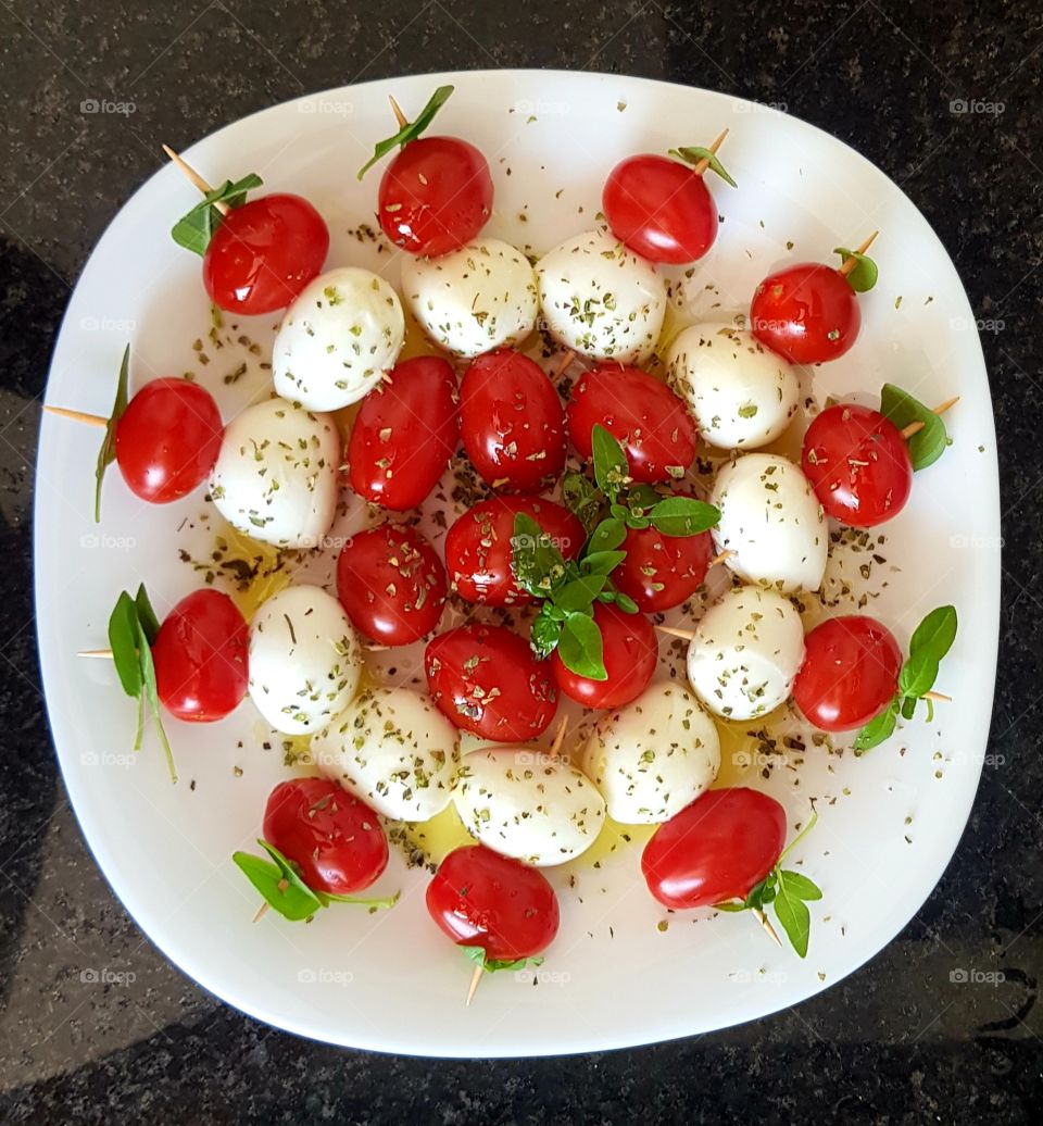 tomatoes, buffalo mozzarella and oregano