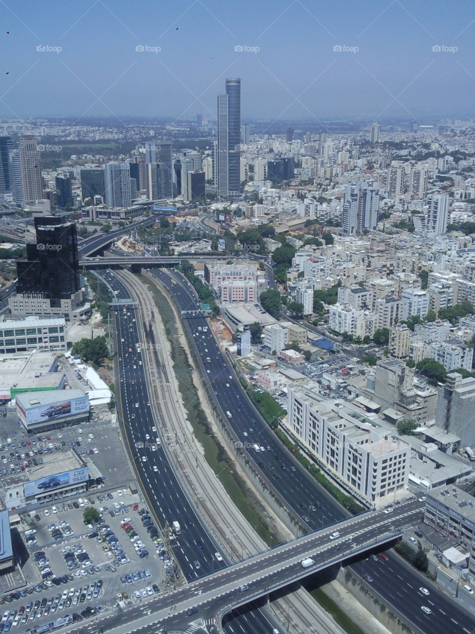 tel-aviv israel buildings cars skyscraper by Evanosaur