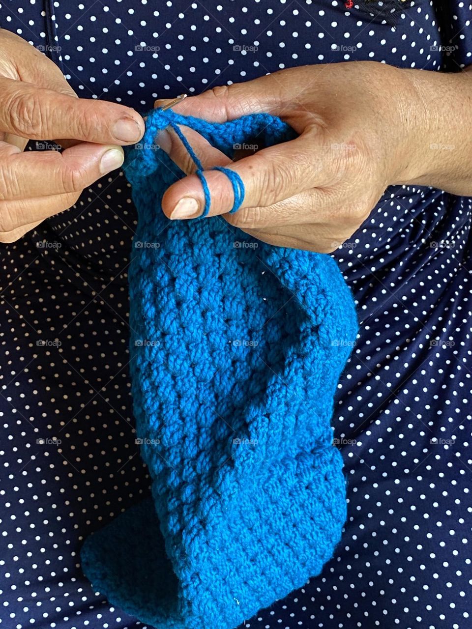 A woman is doing handmade crafts 