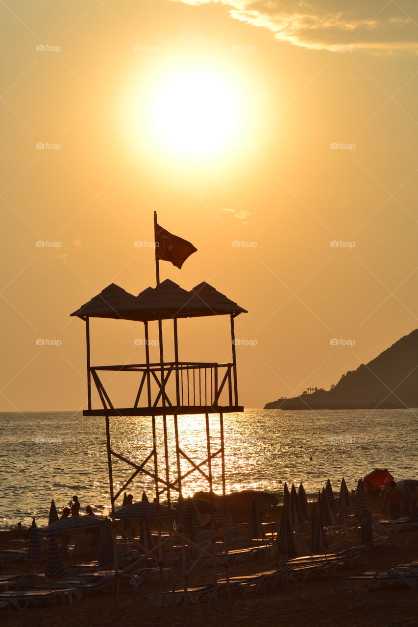 lifeguard tower in sunset