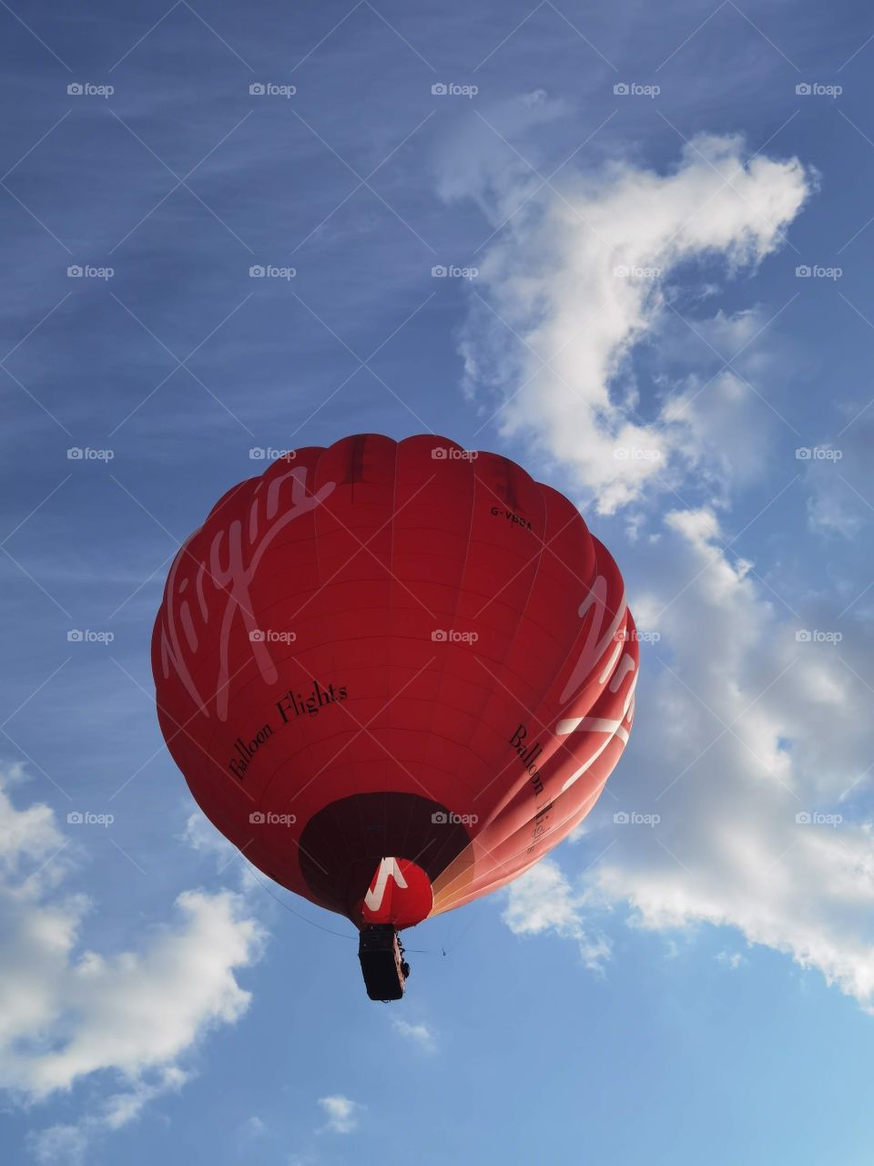red balloon clouds in sky