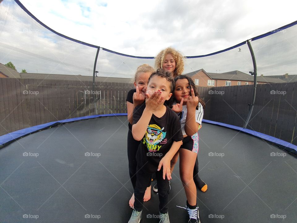 Kids on the trampoline at nans house
