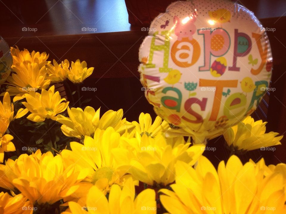 Happy Easter balloon in flowers