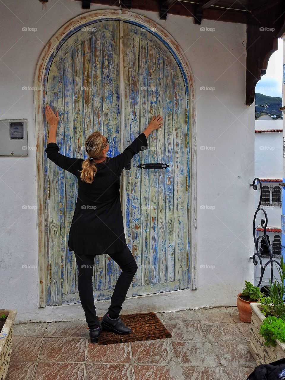 Girl by wooden door