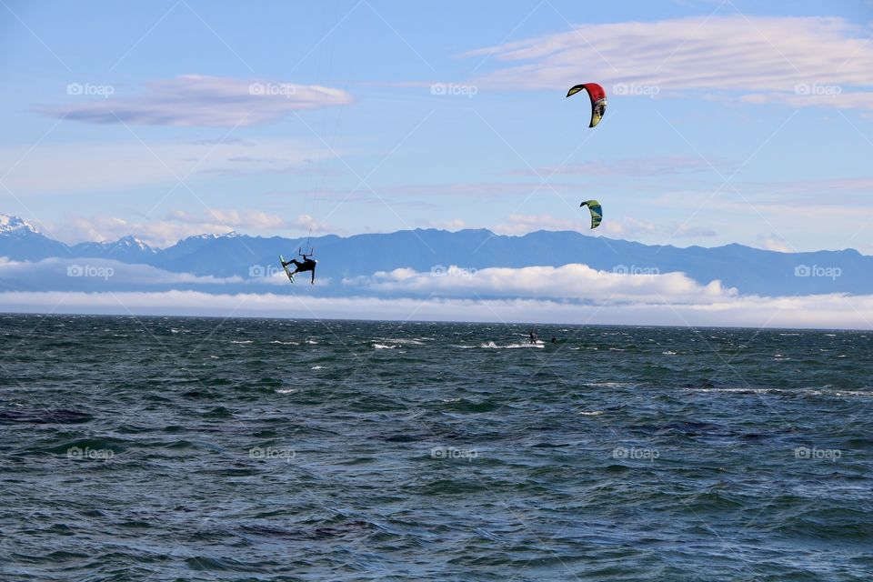 Surfer jumping up in the air 