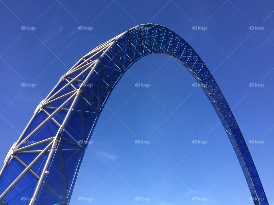 Blue metal arch on blue sky background