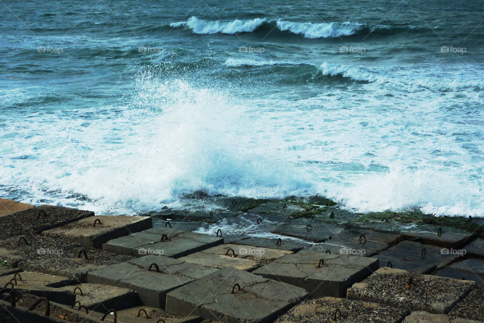 Sea waves hitting rocks