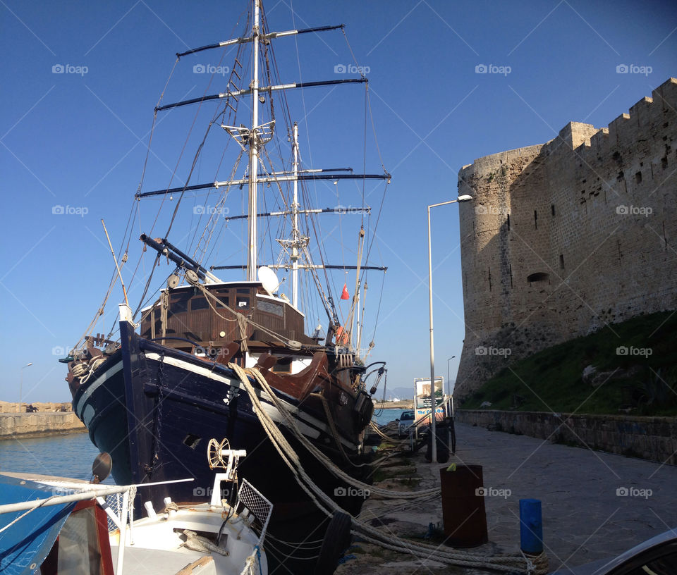 Cypriot harbour with sailing ship in dock