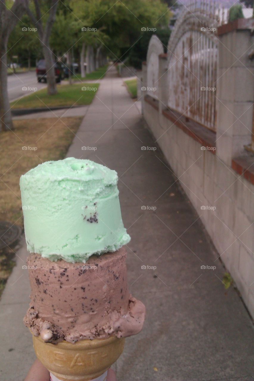 ice cream. enjoying ice cream while on a walk
